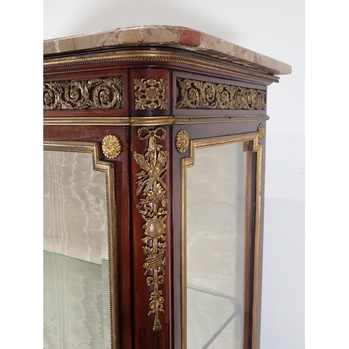 609 - A French Vitrine with marble top, the kingwood frame having ormolu mounts with scrolled leafage and ... 