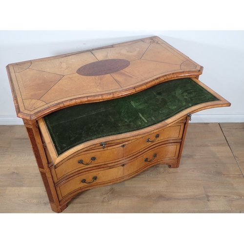 610 - A satinwood serpentine Chest in the George III style fitted brushing slide with Greek key frieze abo... 