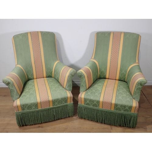 612 - A pair of upholstered Armchairs with green and pink striped upholstery on ebonised turned front supp... 