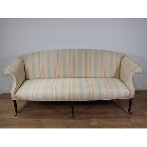 613 - An 18th Century upholstered Settee with arched back, scrolled arms on reeded and tapering front supp... 