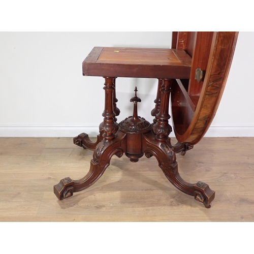 618 - A Victorian walnut Centre Table with oval lifting top on four turned and fluted supports and quadrup... 