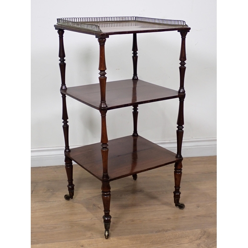 619 - An early 19th Century rosewood three tier Etagere with pierced brass gallery with turned supports an... 