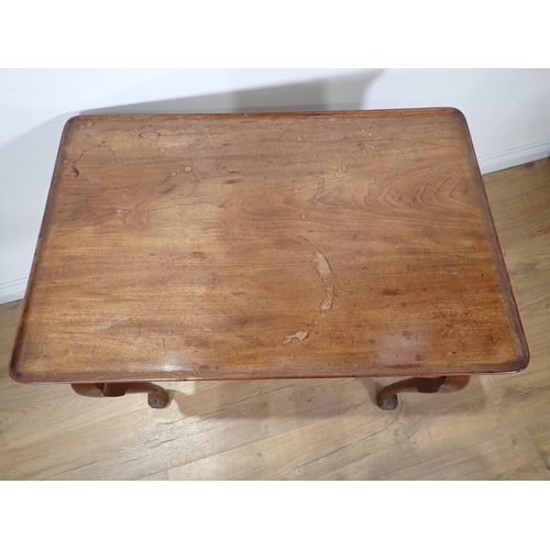 623 - A 19th Century mahogany Silver Table with dished top, shaped frieze on slender cabriole supports and... 