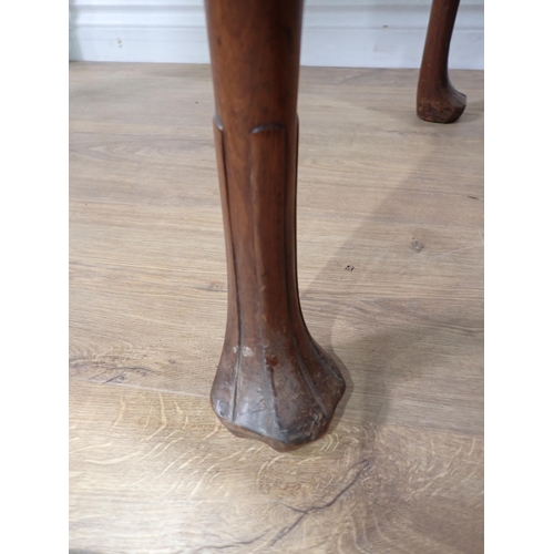 623 - A 19th Century mahogany Silver Table with dished top, shaped frieze on slender cabriole supports and... 