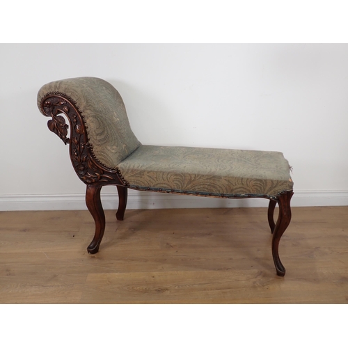 629 - A 19th Century mahogany Chaise of short proportions with flowering branch carving to the scroll end ... 