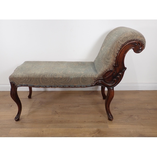 629 - A 19th Century mahogany Chaise of short proportions with flowering branch carving to the scroll end ... 