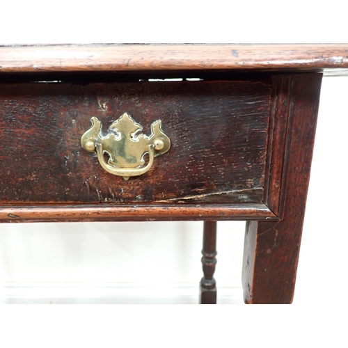 634 - An 18th Century oak Side Table with moulded top, fitted frieze drawer on turned and squared supports... 