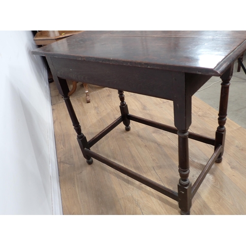 634 - An 18th Century oak Side Table with moulded top, fitted frieze drawer on turned and squared supports... 