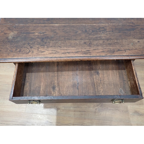 634 - An 18th Century oak Side Table with moulded top, fitted frieze drawer on turned and squared supports... 