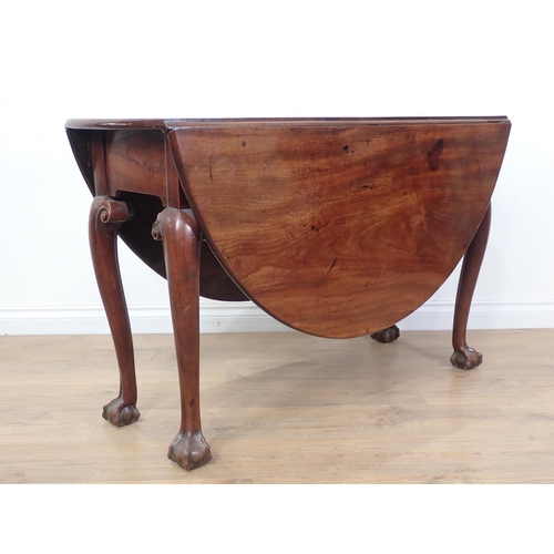 641 - A Georgian Cuban mahogany dropleaf Table with oval top and raised on slender cabriole supports with ... 