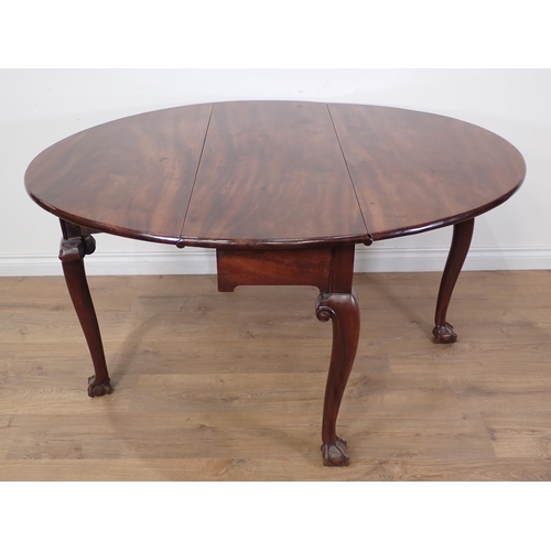 641 - A Georgian Cuban mahogany dropleaf Table with oval top and raised on slender cabriole supports with ... 