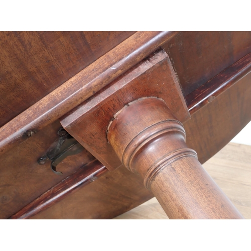 643 - A Georgian mahogany tilt-top Table with single piece top on gun barrel column on tripod base and pad... 