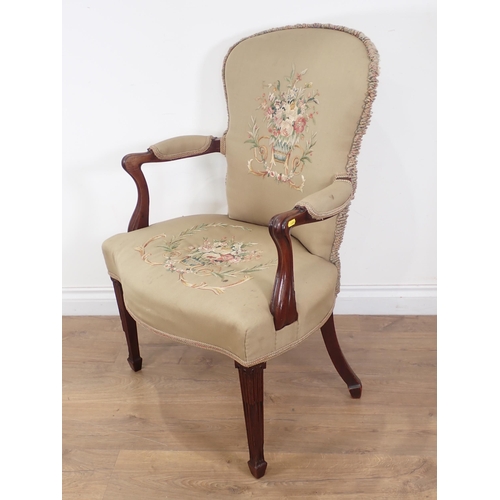 644 - A 19th Century mahogany Elbow Chair, the upholstery with embroidery of baskets of flowers, having sh... 