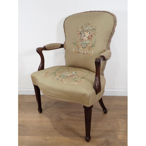 644 - A 19th Century mahogany Elbow Chair, the upholstery with embroidery of baskets of flowers, having sh... 