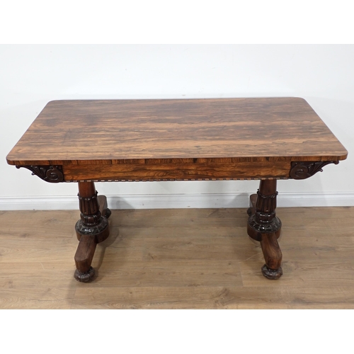 645 - A mid 19th Century carved Rosewood Library Table, the rectangular top above a pair of frieze drawers... 