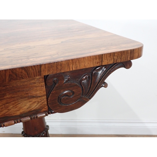 645 - A mid 19th Century carved Rosewood Library Table, the rectangular top above a pair of frieze drawers... 