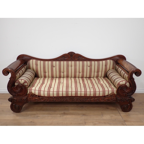 646 - A Regency carved mahogany Settee, the outswept arms and bowed ends above shaped supports and drop-in... 