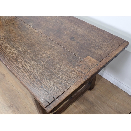 651 - An antique oak small Refectory Table with cleated thick two-plank top on chamfered square legs unite... 