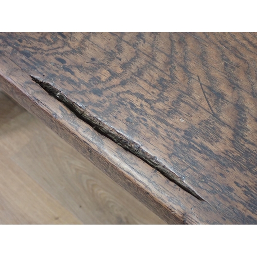 651 - An antique oak small Refectory Table with cleated thick two-plank top on chamfered square legs unite... 