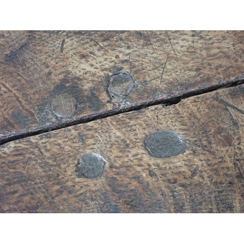 651 - An antique oak small Refectory Table with cleated thick two-plank top on chamfered square legs unite... 