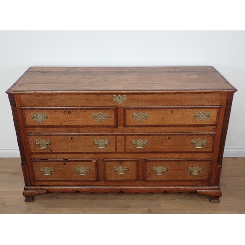 652 - A 19th Century oak Lancashire Chest with crossbanded hinged top above two dummy drawers above one lo... 