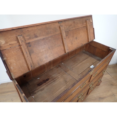 652 - A 19th Century oak Lancashire Chest with crossbanded hinged top above two dummy drawers above one lo... 