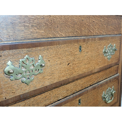 652 - A 19th Century oak Lancashire Chest with crossbanded hinged top above two dummy drawers above one lo... 