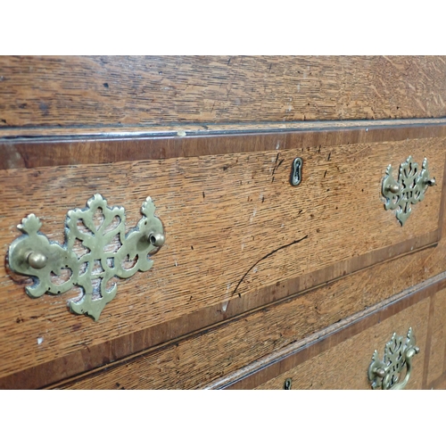 652 - A 19th Century oak Lancashire Chest with crossbanded hinged top above two dummy drawers above one lo... 