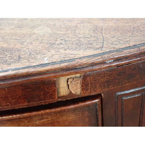 653 - An early 19th Century mahogany bowfront Sideboard fitted pair of drawers flanked by deep drawer and ... 