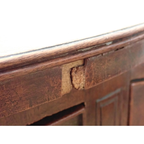 653 - An early 19th Century mahogany bowfront Sideboard fitted pair of drawers flanked by deep drawer and ... 