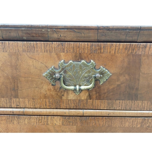 655 - An 18th Century walnut Chest of Drawers, the double crossbanded quartered top above 2 short and thre... 