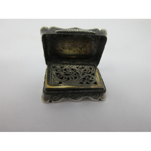 66 - A Victorian silver Vinaigrette with leafage scroll engraving and initials, scroll pierced grille, Bi... 