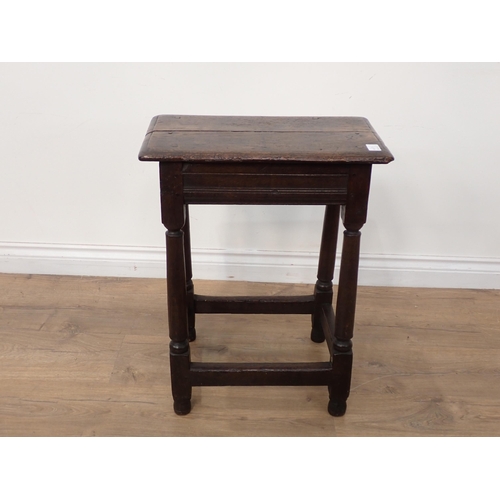 661 - A 17th Century oak Joint Stool with moulded top and frieze on turned tapering supports and squared s... 