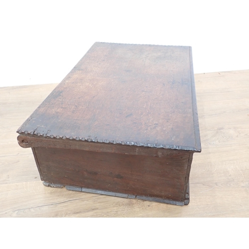 666 - A 17th Century oak Bible Box, the flat lid with chiselled edge, the front with scroll and luneete ca... 