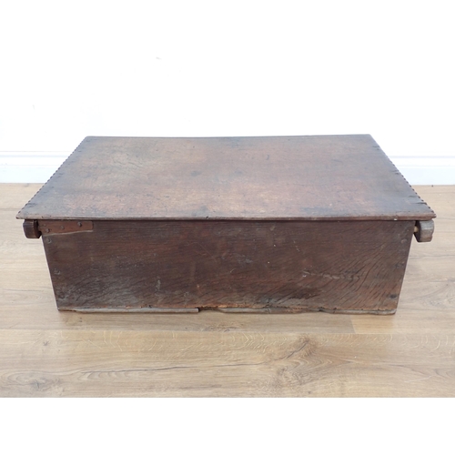 666 - A 17th Century oak Bible Box, the flat lid with chiselled edge, the front with scroll and luneete ca... 