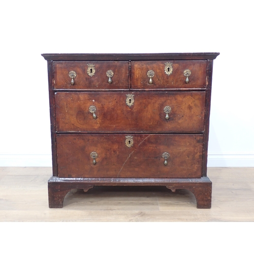 678 - An early 18th Century walnut Chest of two short and two long drawers on bracket supports, 2ft 8in W ... 