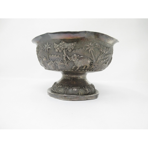 68 - An Indian silver Bowl finely embossed and chased with figures and animals in landscape friezes 
7in ... 