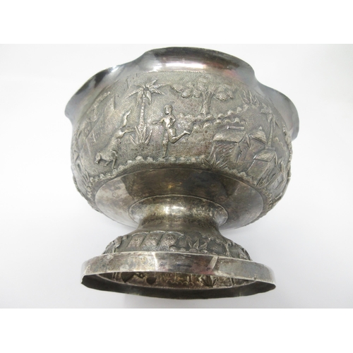 68 - An Indian silver Bowl finely embossed and chased with figures and animals in landscape friezes 
7in ... 