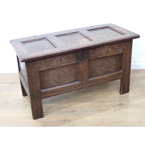 680 - A 17th Century small oak Coffer with panelled top and carved panelled front, 3ft 7in W x 23in H x 19... 