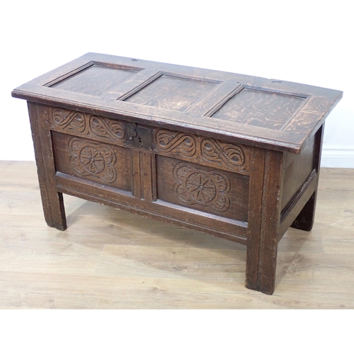 680 - A 17th Century small oak Coffer with panelled top and carved panelled front, 3ft 7in W x 23in H x 19... 