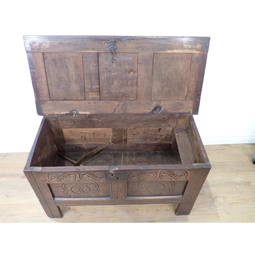 680 - A 17th Century small oak Coffer with panelled top and carved panelled front, 3ft 7in W x 23in H x 19... 