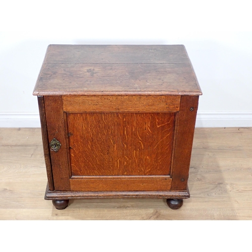 681 - A late 17th Century oak and elm Cupboard with single solid panelled door enclosing three drawers on ... 