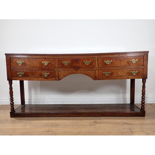 685 - A late 18th Century Welsh oak Dresser Base fitted five drawers on baluster turned front legs with po... 