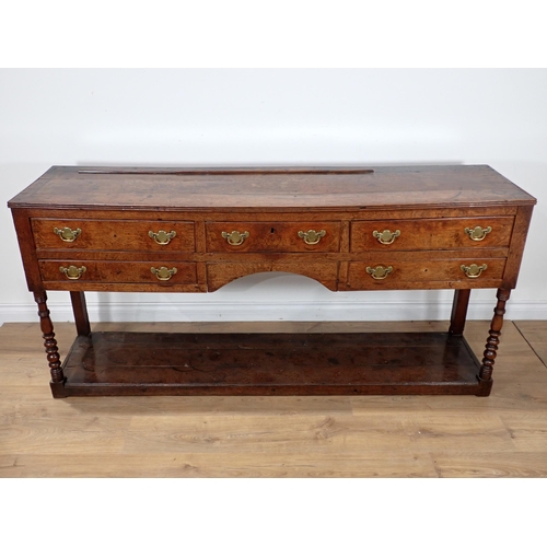 685 - A late 18th Century Welsh oak Dresser Base fitted five drawers on baluster turned front legs with po... 