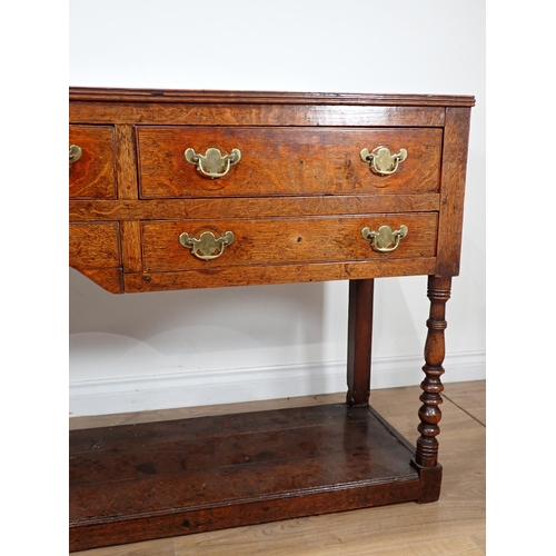 685 - A late 18th Century Welsh oak Dresser Base fitted five drawers on baluster turned front legs with po... 