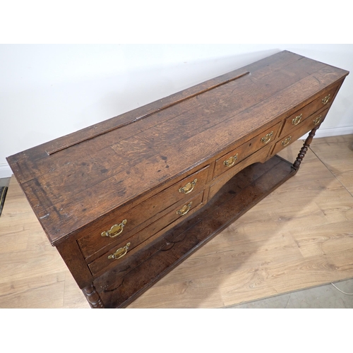 685 - A late 18th Century Welsh oak Dresser Base fitted five drawers on baluster turned front legs with po... 