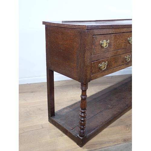 685 - A late 18th Century Welsh oak Dresser Base fitted five drawers on baluster turned front legs with po... 