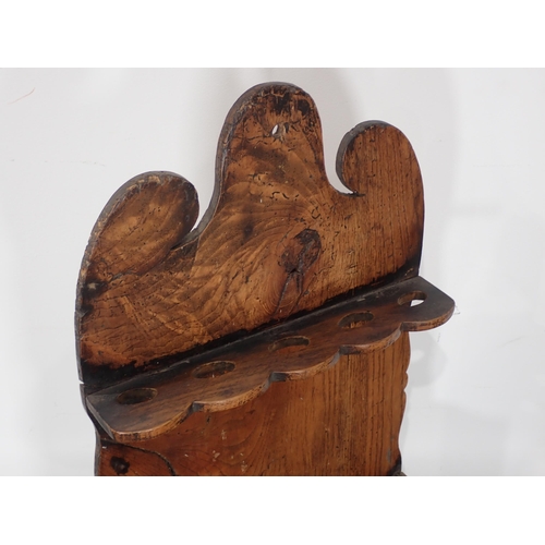 690 - An elm Spoon Rack with shaped surmount above divisions and tray base, 12in W x 21in H