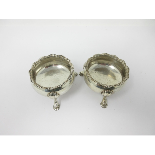 70 - A pair of George II silver Cauldron Salts with shaped rims on cabriole legs and hoof feet, engraved ... 