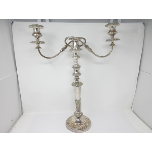 76 - A Sheffield plated two branch, three light Candlestick with floral and leafage decorated tapering co... 